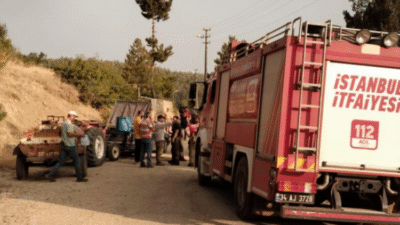 Bursa'nın Harmancık ilçesinde devam eden orman yangını evleri de ciddi